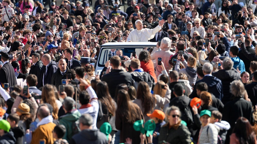Pope Leo XIV greets visitors and pilgrims from the popemobile while riding around St. Peter’s Square at the Vatican before his weekly general audience March 18, 2026. (CNS photo/Lola Gomez)