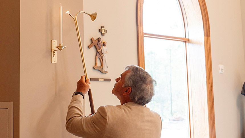 All Saints parishioners will spend Lent 2026 in their new church building. Pictured in the background is one of the church's Stations of the Cross — Simon of Cyrene helps Jesus to carry his cross, which is the 5th station. 