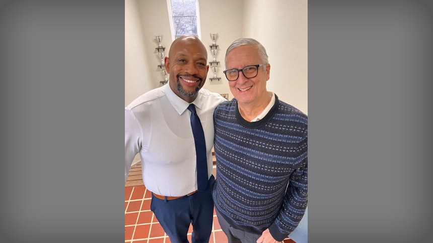 Graham Witherspoon (left) smiles alongside Randy Kilgore, a Cathedral School parent. 