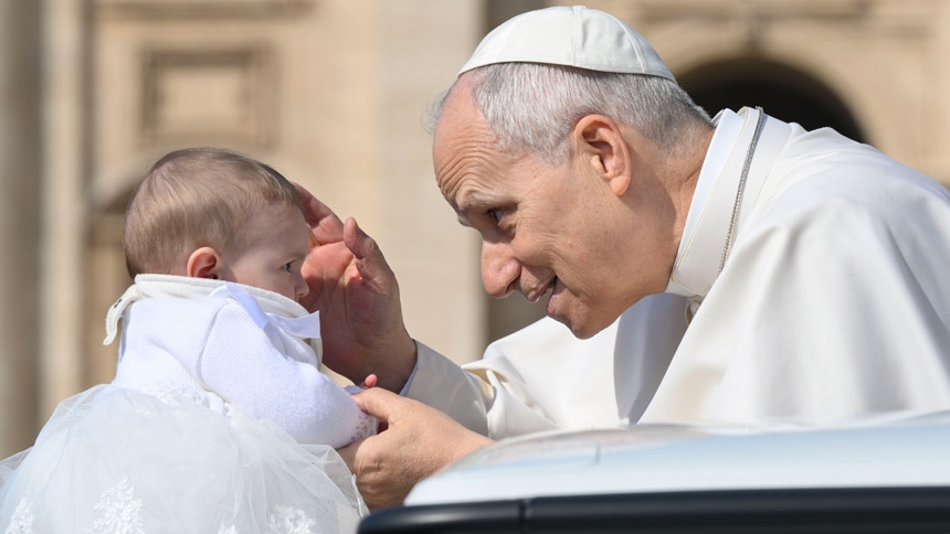 Pope Leo XIV blesses a baby during his general audience in St. Peter's Square at the Vatican March 25, 2026. (CNS photo/Vatican Media)
