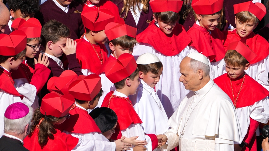 Pope Leo XIV greets students from Our Lady of Mount Carmel Academy in Chicago dressed as cardinals, Swiss Guards and a pope at the end of his weekly general audience in St. Peter’s Square at the Vatican Oct. 8, 2025. The students became known worldwide after their school’s mock conclave went viral for electing their own “pope,” fourth grader Auggie Wilk, who took the name “Augustine.” (CNS photo/Lola Gomez)