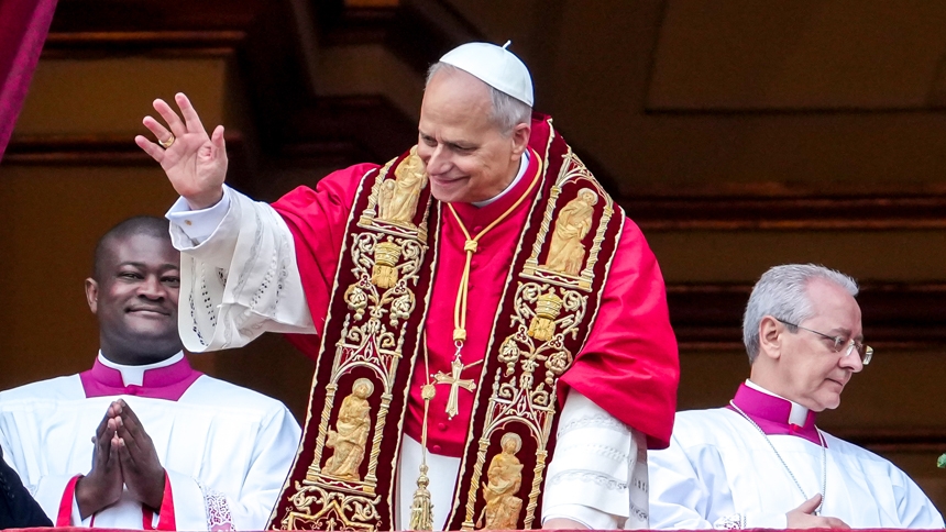 Pope Leo XIV waves to visitors gathered in St. Peter's Square after delivering his Christmas message and blessing "urbi et orbi" (to the city and the world) from the central balcony of St. Peter's Basilica at the Vatican Dec. 25, 2025. (CNS photo/Lola Gomez)