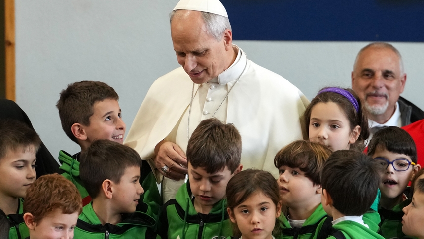 Pope Leo XIV chats with children before posing for a group photo during his pastoral visit to the Parish of Santa Maria Regina Pacis in Ostia Lido, Italy, Feb. 15, 2026. (CNS photo/Lola Gomez)