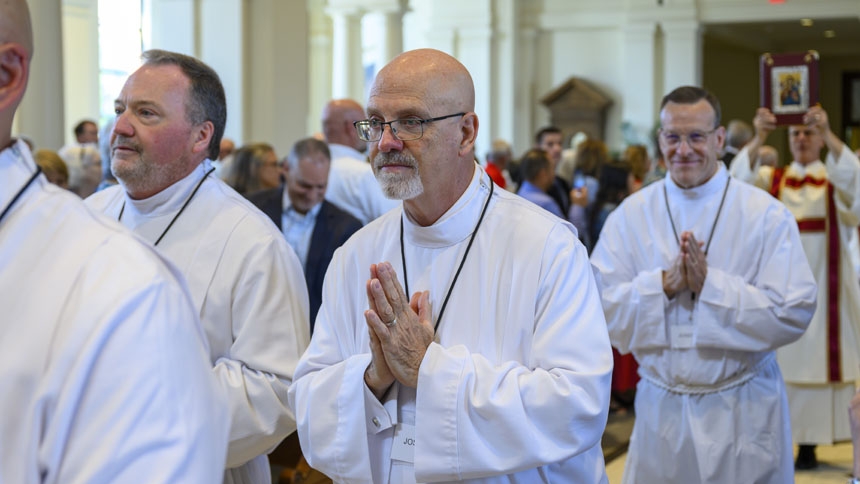 Joseph Martin Sebik, forefront, processes into cathedral as Mass begins.