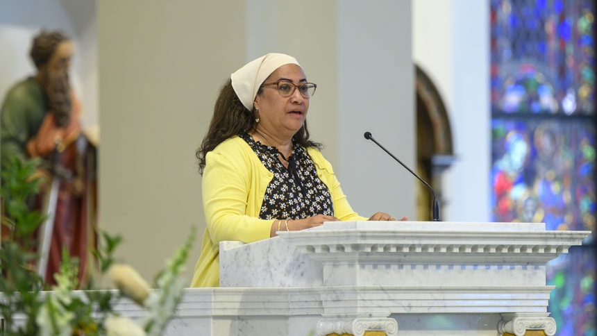 Ilka Cordova, wife of Deacon Antonio Cordova, reads from the Book of Ephesians.