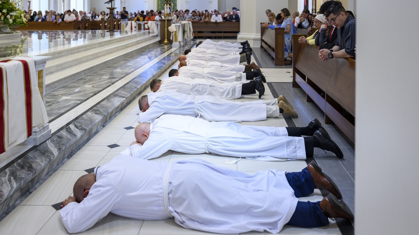 The elect prostrate themselves as congregation sings the Litany of the Saints.