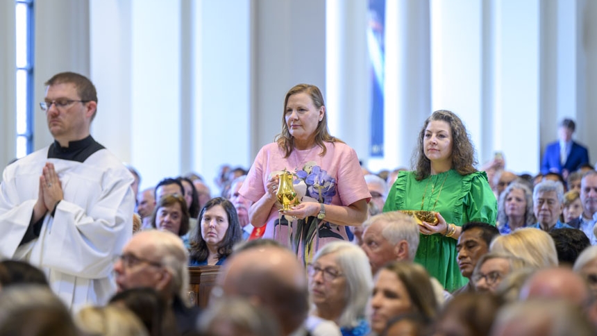Lynn Rosende (left) and Nicole Sebum present the gifts.