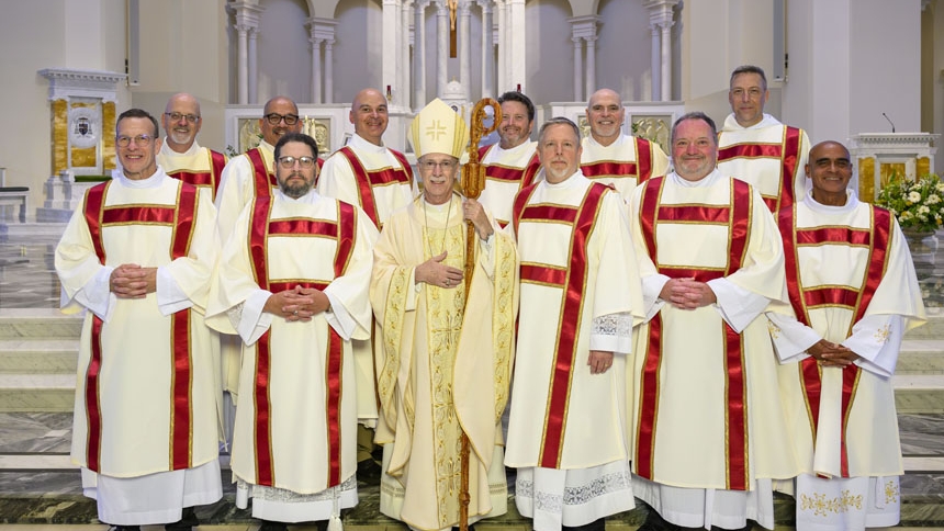 The new deacons gather for a photo with Bishop Luis.