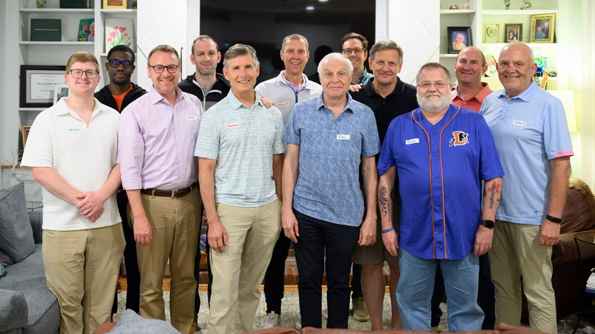 Jacob House (front  row, second from left) and  Matthew Kane, (front row,  third from left) were early champions of Journeymen. Here, the group gathers at the home of Steve Monti, pictured back row, second from right.