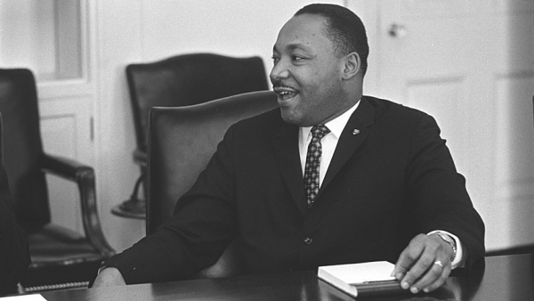 Civil rights leader the Rev. Martin Luther King Jr. smiles during a talk with U.S. President Lyndon B. Johnson, not pictured, in this undated photo. (CNS photo/Yoichi Okamoto, courtesy LBJ Library)