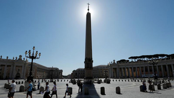 People walk in St. Peter's Square as Pope Francis gives his weekly general audience livestreamed from the library of the Apostolic Palace at the Vatican Aug. 5, 2020. (CNS photo/Remo Casilli, Reuters)