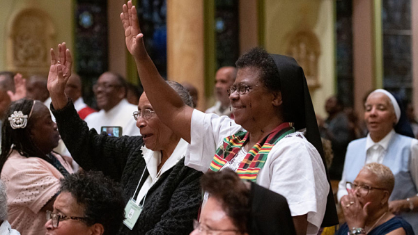  Sister Beulah Martin, a member of the Sisters of the Blessed Sacrament, center right, of Powhatan, Va., waves in Baltimore's historic St. Francis Xavier Church July 22, 2019, at a Mass honoring jubilarians during a joint conference of black priests, women religious, deacons and seminarians. (CNS photo/Kevin J. Parks, Catholic Review)