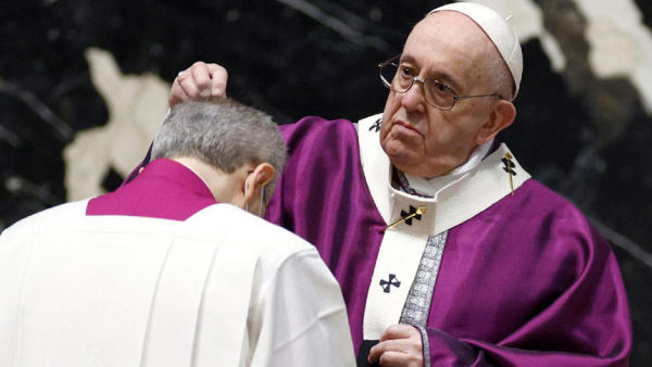 Pope Francis sprinkles ashes on the head of a priest during Ash Wednesday Mass in St. Peter's Basilica at the Vatican Feb. 17, 2021. (CNS photo/Guglielmo Mangiapane, Reuters)