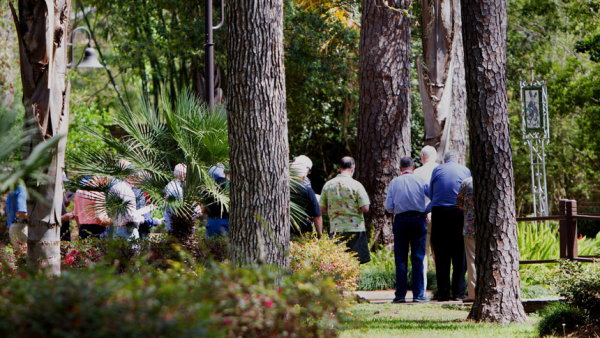 Men on a 2017 retreat walk through a garden praying the Stations of the Cross in a garden at Holy Name Passionist Retreat Center in Houston. (CNS photo/James Ramos, Texas Catholic Herald)