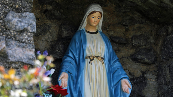 A statue of Mary is displayed at a grotto in North Beach, Md., July 15, 2021. (CNS photo/Bob Roller)