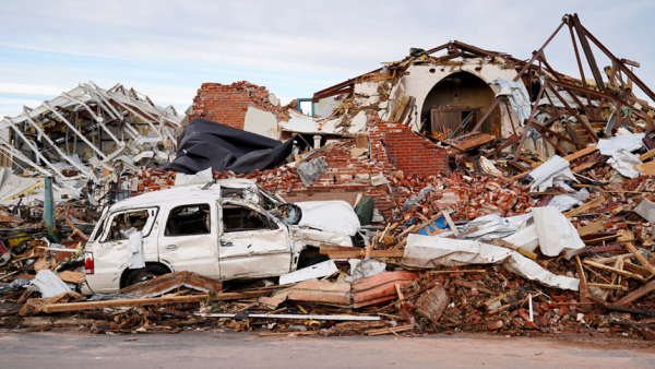 Debris surrounds a destroyed home in Mayfield, Ky., Dec. 11, 2021, after a devastating tornado ripped through the town. More than 30 tornadoes were reported across six states late Dec. 10, and early Dec. 11, killing dozens of people and leaving a trail of devastation. (CNS photo/Cheney Orr, Reuters)