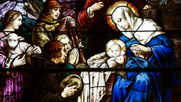 The birth of Jesus is depicted in a stained-glass window at Our Lady Star of the Sea Church in Cape May, N.J. The feast of the Nativity of the Lord is celebrated Dec. 25. (CNS photo/Gregory A. Shemitz)