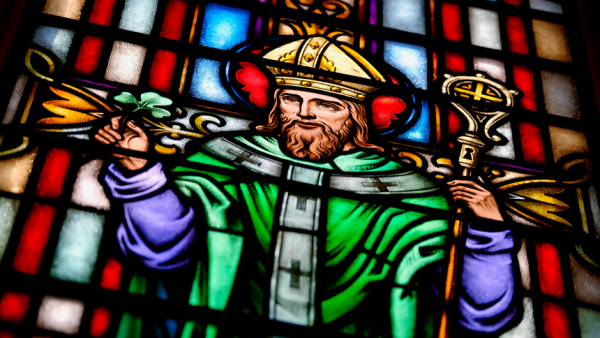 A stained-glass window depicting Saint Patrick is seen inside the chapel at the Diocesan Pastoral Center at the Diocese of Rochester, N.Y., March 17. (CNS photo/Mike Crupi, Catholic Courier)