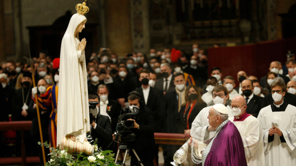 Pope Francis makes the sign of the cross in front of a Marian statue after consecrating the world and, in particular, Ukraine and Russia to the Immaculate Heart of Mary during a Lenten penance service in St. Peter's Basilica at the Vatican March 25, 2022. (CNS photo/Paul Haring)