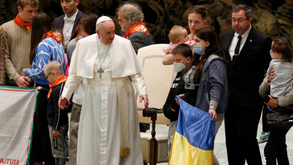 Pope Francis meets refugees from Ukraine during his general audience in the Paul VI hall at the Vatican March 30, 2022. The pope asked people to pray for his upcoming trip to Malta and to pray for an end to the "savage cruelty" of war. (CNS photo/Paul Haring)