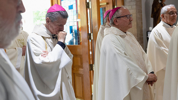Archbishop Gustavo García-Siller of San Antonio processes into Sacred Heart Catholic Church in Uvalde, Texas, to celebrate Mass May 25, 2022, one day after a gunman killed 19 children and two teachers at Robb Elementary School. (CNS photo/Nuri Vallbona, Reuters)