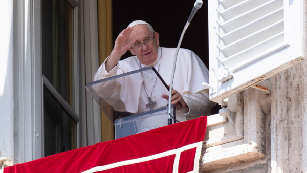 Pope Francis greets the crowd as he leads the Angelus from the window of his studio overlooking St. Peter's Square at the Vatican Aug. 22, 2022. (CNS photo/Vatican Media)