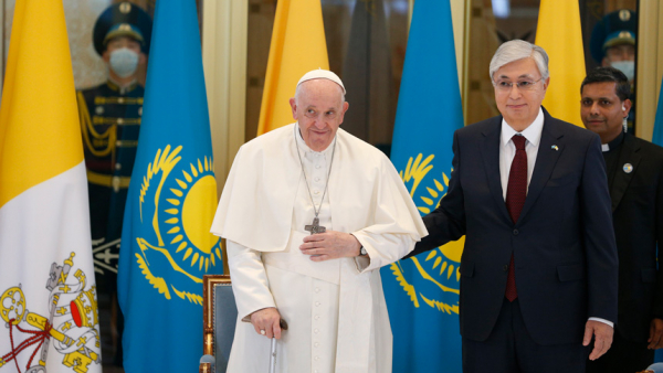 Pope Francis is welcomed by Kazakh President Kassym-Jomart Tokayev as he arrives at the international airport in Nur-Sultan, Kazakhstan, Sept. 13, 2022. The pope is attending the Congress of Leaders of World and Traditional Religions in Nur-Sultan. (CNS photo/Paul Haring)