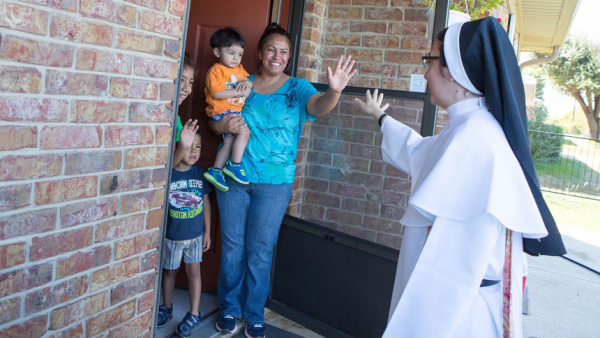 Sister Gabriela Luna Diaz, a member of the Eucharistic Missionaries of St. Teresa, visits a Hispanic family in northwestern Wisconsin in this Oct. 14, 2015, file photo. The Vatican released Pope Francis' message for World Mission Sunday, which will be celebrated Oct. 23 with the theme, "You shall be my witnesses." (CNS photo/Rich Kalonick, Catholic Extension)