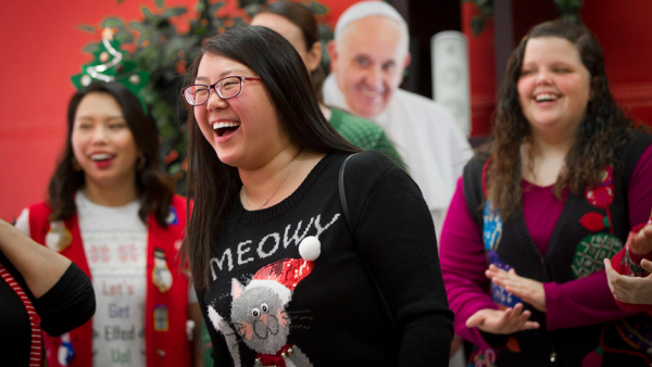 eline Do laughs during a campus ministry contest for ugly Christmas sweaters on the campus of Lamar University in Beaumont, Texas, in this 2015 file photo. For those who had a wonderful campus ministry experience, recall what those days were like after graduation. (CNS photo/Tyler Orsburn)