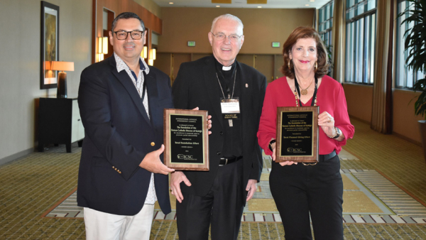 Rick Herrera (left) and Donna Ashcraft (right) stand with Bishop Donald Hanchon of the Archdiocese of Detroit. The Foundation of the Roman Catholic Diocese of Raleigh won ICSC awards for Total Planned Giving Effort and Total Foundation Effort.