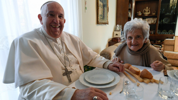 Pope Francis and Carla Rabezzana, his second cousin, sit down to lunch in her home in Portacomaro, near Asti, Nov. 19, 2022. The pope traveled to the northern Italian town to help celebrate Rabezzana's 90th birthday, to visit other relatives and to celebrate Mass the next day in the Asti cathedral. (CNS photo/Vatican Media)