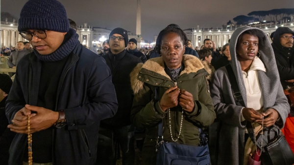 People join Cardinal Pietro Parolin, Vatican secretary of state, in reciting the rosary for Pope Francis in St. Peter's Square at the Vatican Feb. 24, 2025. Cardinals living in Rome, leaders of the Roman Curia and the faithful joined the nighttime prayer. (CNS photo/Pablo Esparza)