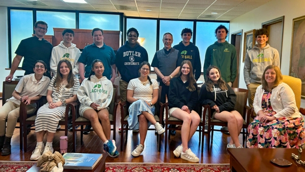 Students visit Bishop Luis, Catholic Center