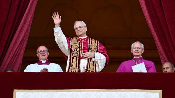 Pope Leo XIV, the former Cardinal Robert F. Prevost, waves to the crowds in St. Peter's Square at the Vatican after his election as pope May 8, 2025. The new pope was born in Chicago. (CNS photo/Vatican Media)