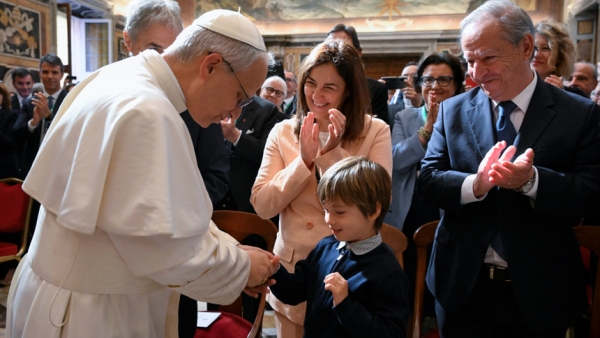 Pope Leo XIV greets a child after meeting with members of the Centesimus Annus Foundation in the Clementine Hall of the Apostolic Palace at the Vatican May 17, 2025. The foundation promotes Catholic social teaching. (CNS photo/Vatican Media)