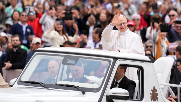 Pope Leo XIV rides through St. Peter's Square at the Vatican May 21, 2025, before holding his first weekly general audience. (CNS photo/Lola Gomez)