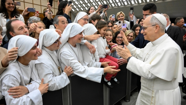 Pope Leo XIV greets religious sisters during a meeting with officials and employees of the Roman Curia, Vatican City State and the Diocese of Rome in the Paul VI Audience Hall at the Vatican May 24, 2025. (CNS photo/Vatican Media)