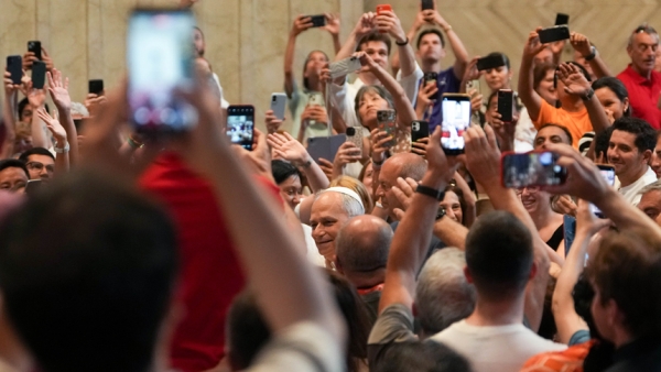 Pope Leo XIV greets people as he enters St. Peter’s Basilica for an audience with pilgrims in Rome for the Holy Year 2025 at the Vatican June 14, 2025. (CNS photo/Lola Gomez)