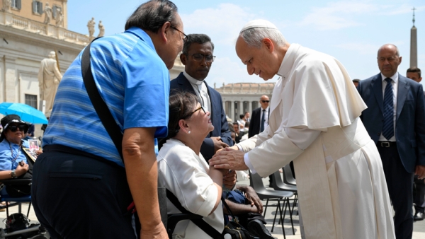 Pope Leo XIV blesses a woman in St. Peter's Square after his general audience at the Vatican June 18, 2025. (CNS photo/Vatican Media)