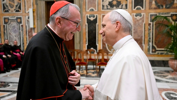 Pope Leo XIV greets Cardinal Pietro Parolin, Vatican secretary of state, during a meeting at the Vatican with priests who staff nunciatures and other Vatican diplomatic missions around the world Nov. 17, 2025. (CNS photo/Vatican Media)