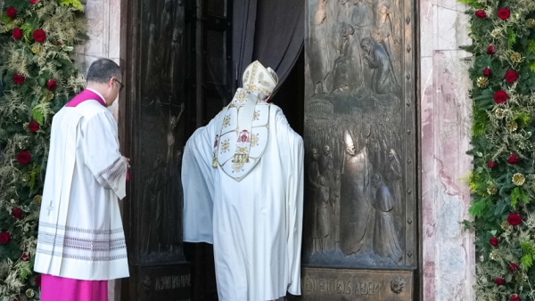Cardinal James M. Harvey, archpriest of Rome's Basilica of St. Paul Outside the Walls, closes the basilica's Holy Door Dec. 28, 2025, as the Jubilee Year was about to end. (CNS photo/Lola Gomez)