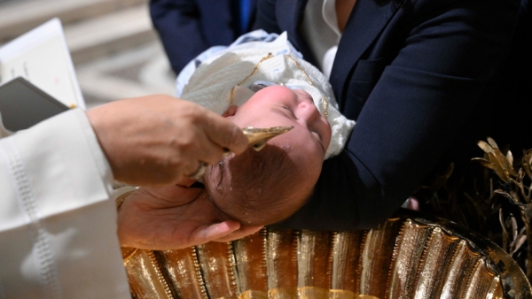 Pope Leo XIV baptizes a baby during Mass in the Sistine Chapel at the Vatican, Jan. 11, 2026, the feast of the Baptism of the Lord. (CNS photo/Vatican Media)