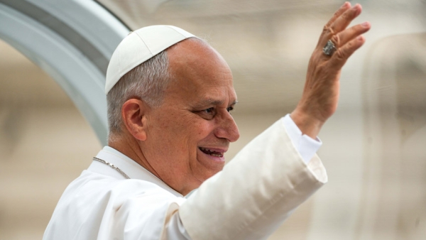 Pope Leo XIV greets visitors and pilgrims from the popemobile while riding around St. Peter’s Square at the Vatican before his weekly general audience May 13, 2026. (CNS photo/Lola Gomez)