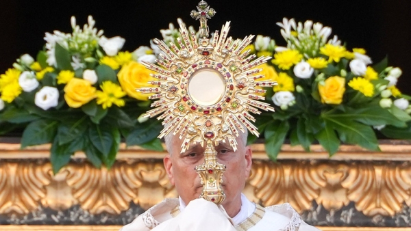 In this file photo, Pope Leo XIV raises the monstrance during Benediction after a Corpus Christi procession to Rome's Basilica of St. Mary Major June 22, 2025. (CNS photo/Lola Gomez)
