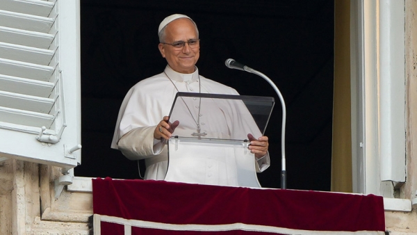 Pope Leo XIV smiles at the conclusion of the Angelus prayer from a window of the Apostolic Palace at the Vatican Oct. 18, 2026, a day after being discharged from Rome’s Gemelli hospital following surgery to remove his lower right lung to treat a cancerous tumor. (CNS photo/Lola Gomez)