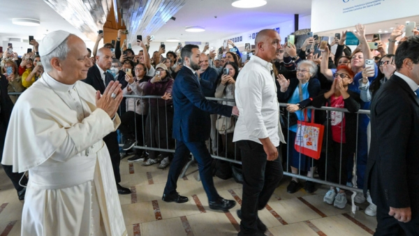 Pope Leo XIV greets hospital staff and well-wishers as he arrives at Rome's Gemelli Hospital Oct. 13, 2026, for an operation that afternoon to remove a nodule in his lung. (CNS photo/Vatican Media)